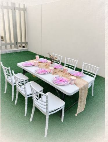 Pink children's party table with kids' Chiavari chairs